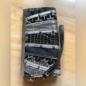Clutch wristlet. Not sure of the brand.  Gorgeous black and silver.  0024
